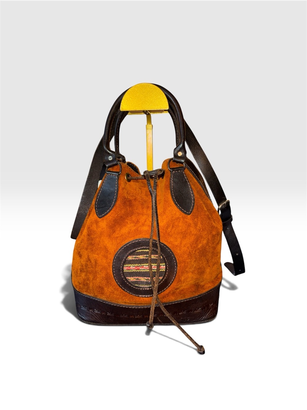Manta Medallion Cinch Suede Drawstring Bucket Bag in Burnt Orange